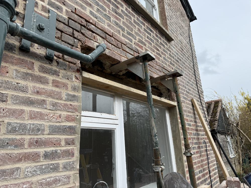 New angle iron lintel installed where a slipped soldier course had no original lintel, Southampton
